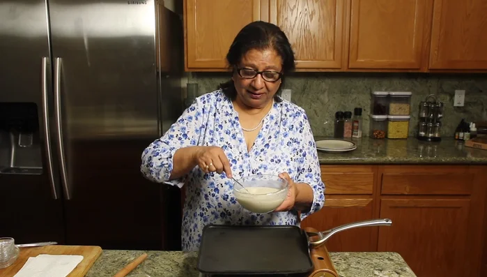 Add finely chopped cilantro (coriander) leaves to the batter and mix well.