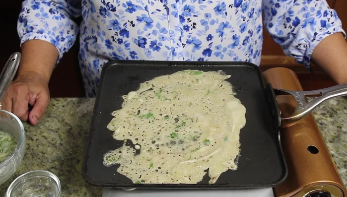 Cook the dosa until golden brown and crispy, about 2-3 minutes on each side.