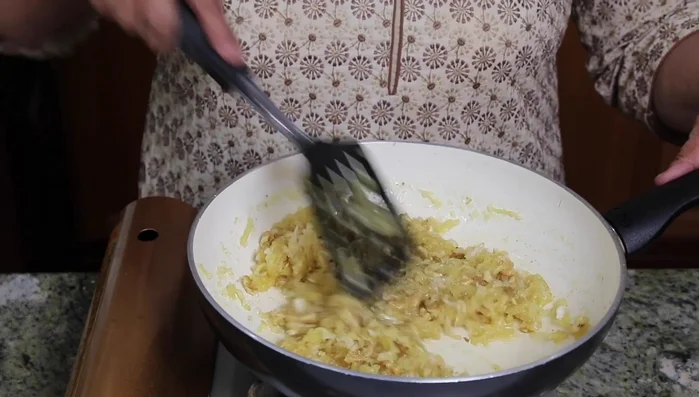 Continue stirring until the mixture thickens and comes together.