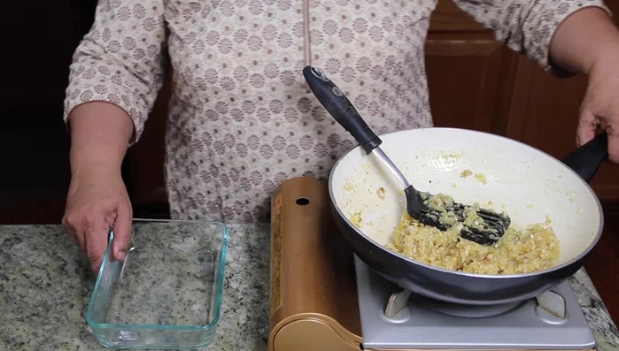 Transfer the mixture to a greased 5x7 Pyrex dish. Press firmly.