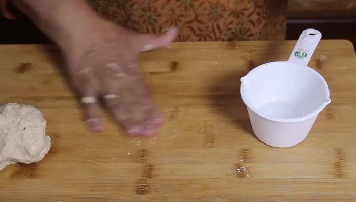Divide the dough into small balls. Roll each ball into a circle.