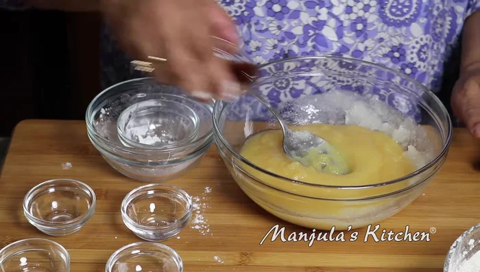 Add apple sauce and vanilla extract to the oil and sugar mixture. Mix well.