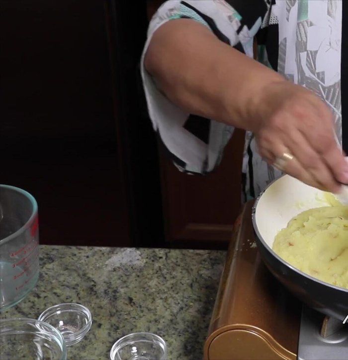Slowly add the remaining ghee (3 tablespoons), one tablespoon at a time, mixing well after each addition.