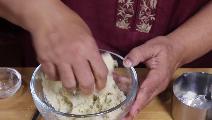 Roll the dough into a rectangle or square on a lightly oiled surface.