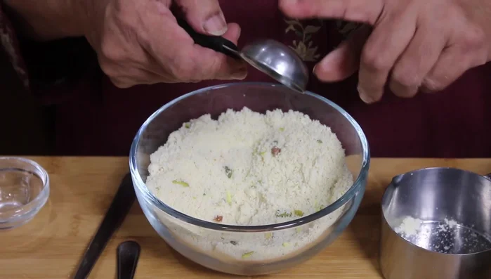 Add condensed milk and mix thoroughly until a smooth dough forms.