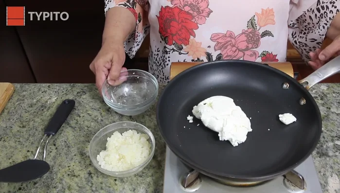 Add the paneer to the sugar syrup. Mix well.