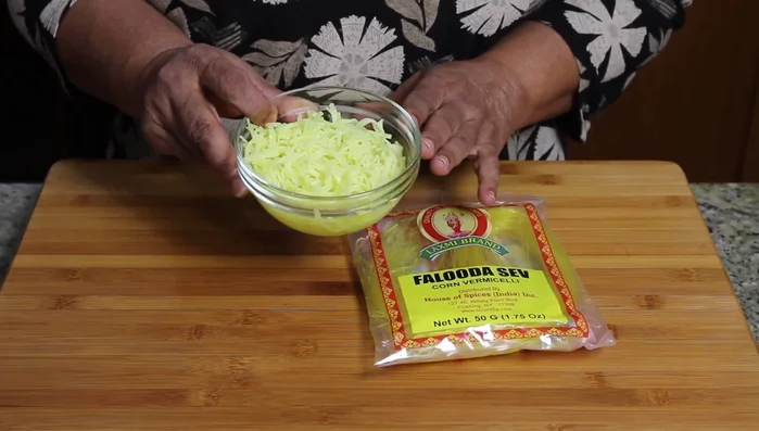 Boil falooda noodles until tender, drain, and chill.