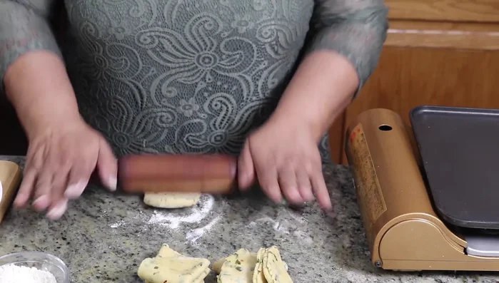 Repeat with remaining dough balls.