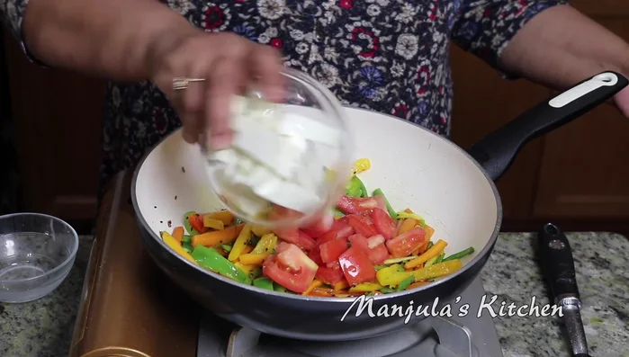 Add tomatoes and cook until soft.