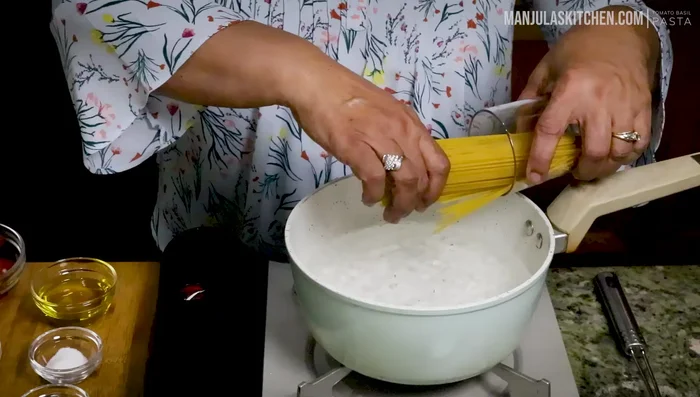 Cook the pasta in boiling water for 8 minutes until tender but not soft. Drain the water, reserving about half a cup.