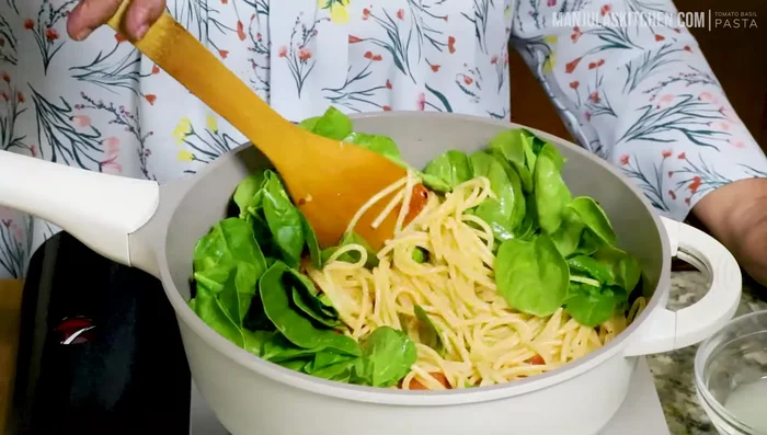 Add baby spinach and stir until wilted.
