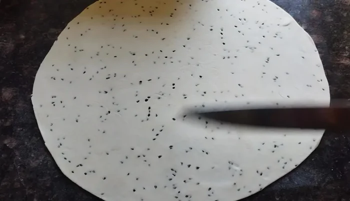 Cut the rolled dough into desired shapes (e.g., diamond, square, long pieces).