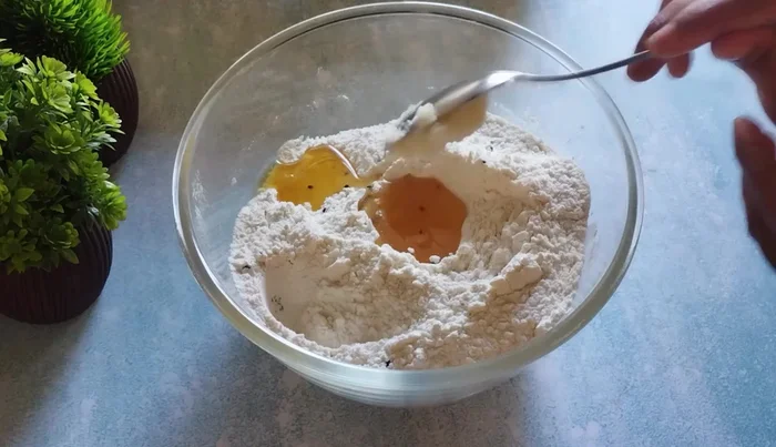 Add refined oil and ghee. Mix until the mixture becomes crumbly.