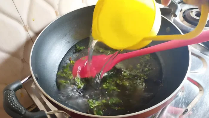 Add water, semolina, salt, and chili flakes. Stir well and bring to a boil.