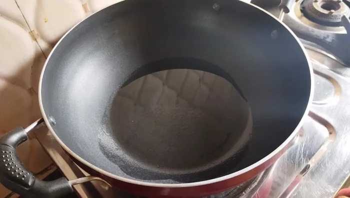 Heat oil in a pan. Add mustard seeds and cumin seeds. Once they splutter, add green chilies and sauté for 2-3 minutes.