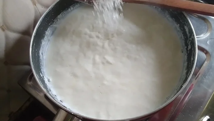 Once the milk has reduced significantly, add 1 1/4 cups of sugar. Avoid adding too much sugar.