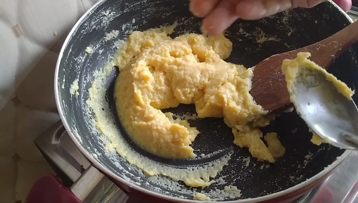 To check for doneness, take a small amount of the mixture, form it into a ball. If it holds its shape, it's ready.