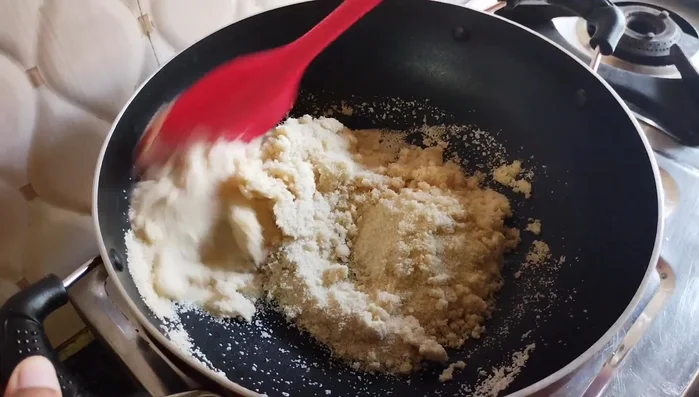 Dry roast semolina in the same pan over low heat, stirring continuously, until golden brown (10-15 minutes).