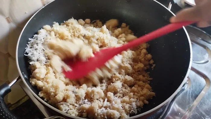 Add desiccated coconut and mix well. Transfer to a bowl and let it cool.