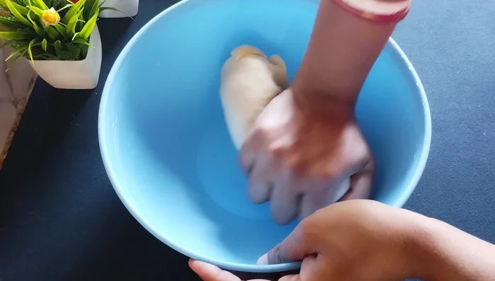 Knead the dough again to make it smooth. Roll out small portions of the dough into thin circles.