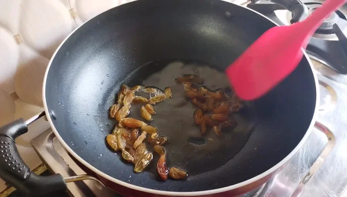 Fry raisins until plump. Remove immediately.