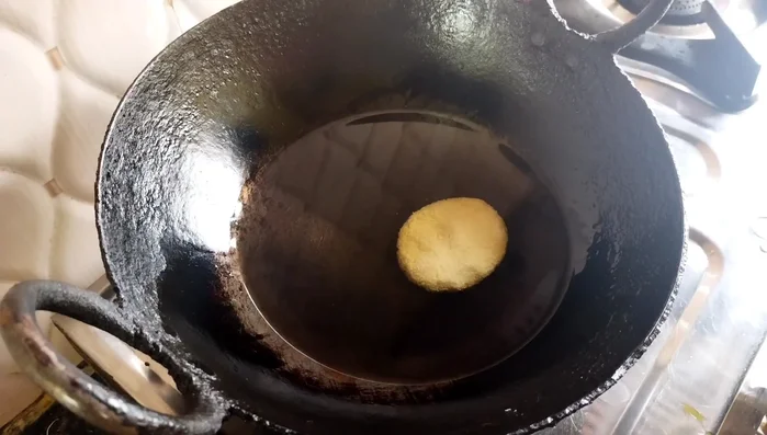Heat oil in an iron pan on low heat. Fry the biscuits on very low flame until golden brown, turning them gently with a spoon to prevent breaking.