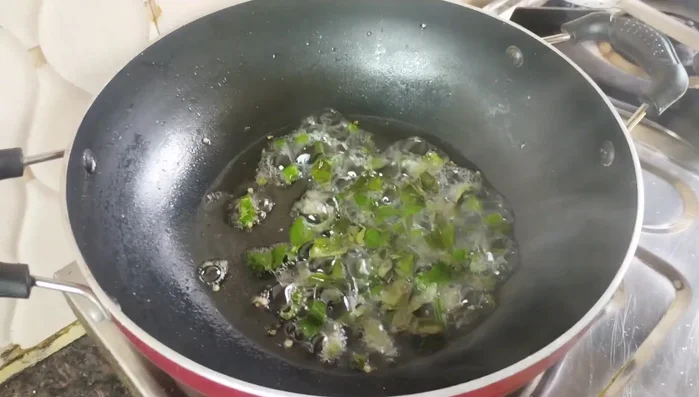 Add Curry Leaves and Turmeric: Add 10-12 chopped curry leaves and 1/2 teaspoon turmeric powder. Roast lightly until the raw smell of turmeric is gone.
