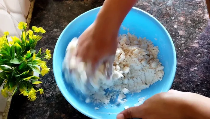 Gradually add water, kneading until you have a firm, hard dough. Set aside for 30 minutes.