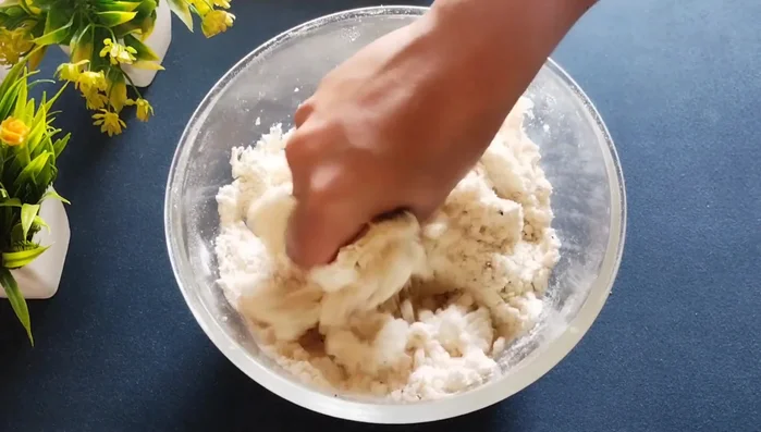 Gradually add milk (or water) to form a stiff dough. Add it slowly as the sugar may make it wet quickly.