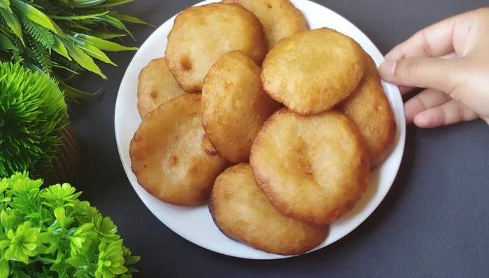 Remove the fried Pua from the oil and drain on a paper towel. Repeat with the remaining batter.