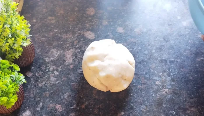 Knead the dough again to make it smooth. Make it into small balls.