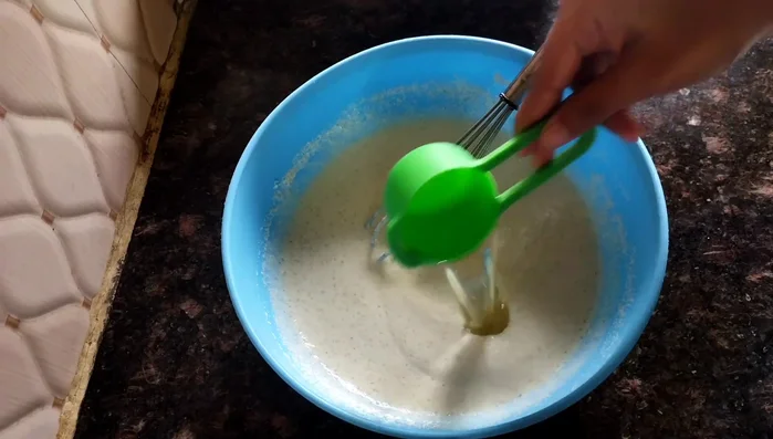 Add 1/4 cup of oil and mix well. Let the mixture rest for half an hour.