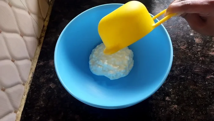 In a mixing bowl, beat 1/2 cup of curd until smooth.