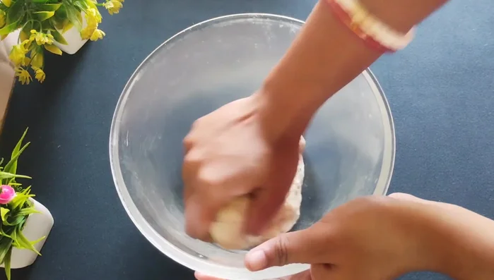 Knead the dough again until smooth.