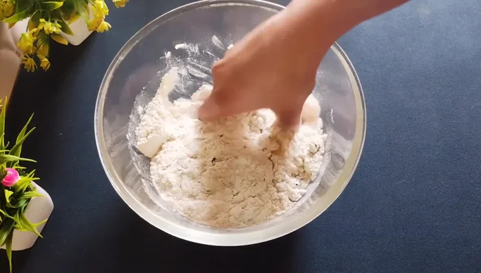 Add refined oil or ghee and rub it into the flour until it resembles breadcrumbs.