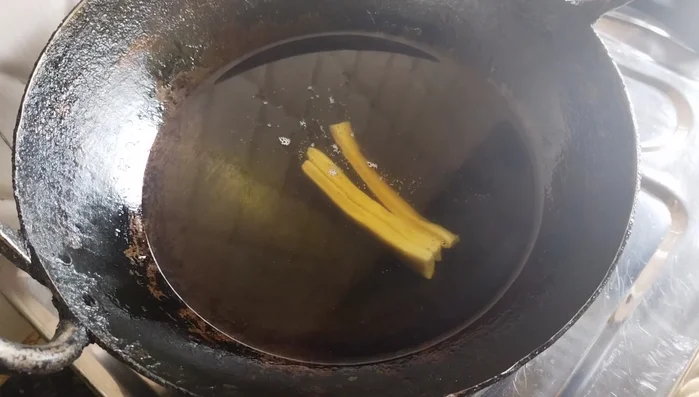 Heat oil in a pan over low heat. Fry the Shakkar Para in batches until golden brown, about 6-7 minutes per batch. Ensure the oil is not too hot and maintain a low flame for even cooking and crispiness.