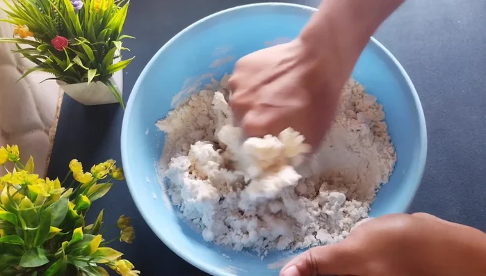 Gradually add water (about 1 cup) to make a stiff dough. The dough should be firm, not soft.