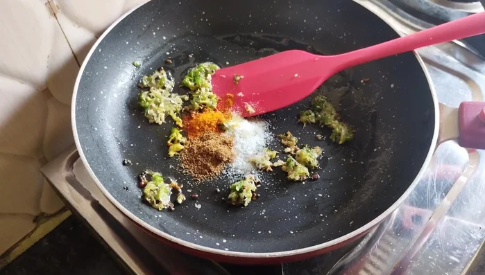 Add salt, turmeric powder, cumin seeds, and red chili powder. Sauté for 3-4 minutes.