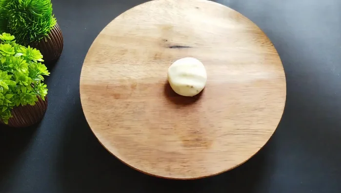 Roll each ball into a thin oval shape, not too thin or too thick.