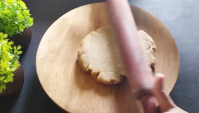 Roll out the discs to medium thickness, patching any cracks as needed. Avoid making the dough too thin or too thick.