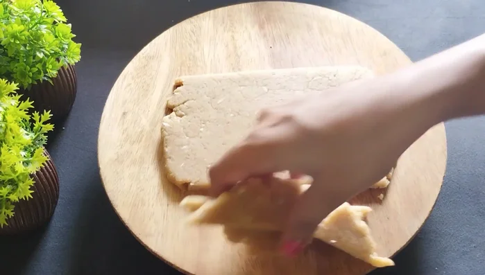 Cut out biscuit shapes using a knife or cookie cutter. You can make them square, round, or any other shape you like.