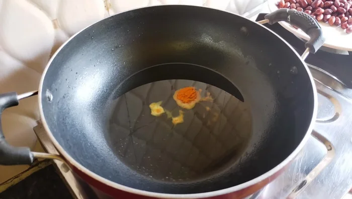In the same pan, lightly fry turmeric powder to remove the raw smell.