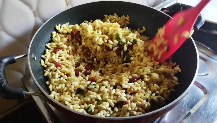 Turn off the heat. Add the sieved masala and mix thoroughly until the turmeric color is evenly distributed.