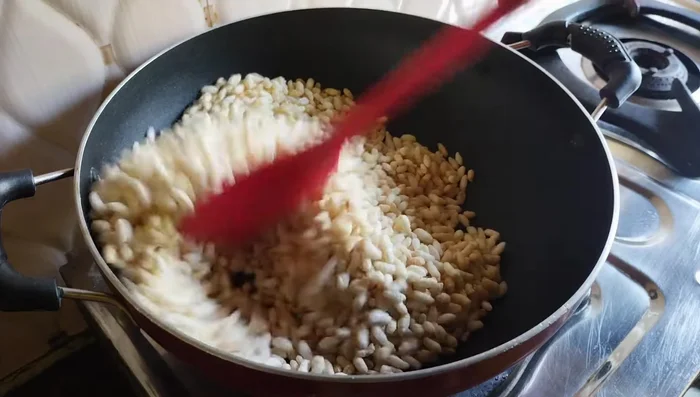 Lightly roast the puffed rice in a pan on low flame for 2-3 minutes to make it extra crispy. (Avoid sogginess)