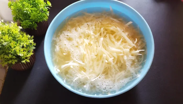 Wash the grated potatoes at least four to five times to remove excess starch and foam.