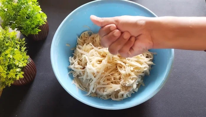 Shape the potato mixture into small, tightly packed balls (like laddoos).