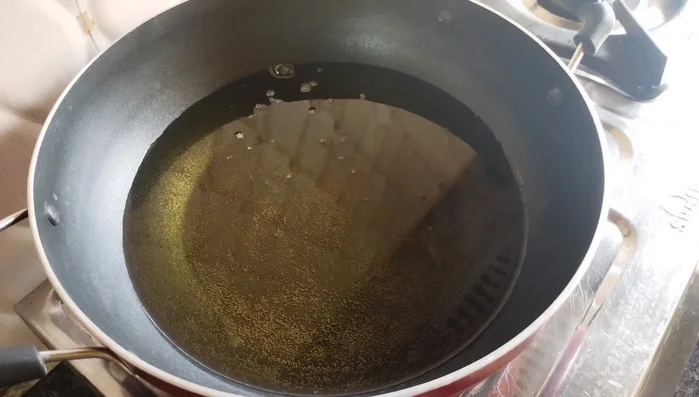 Heat oil in a frying pan over high heat. Carefully add the potato balls to the hot oil, ensuring not to overcrowd the pan.