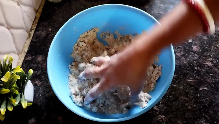 Gradually add water, mixing until a firm, stiff dough is formed. Do not make it too soft.