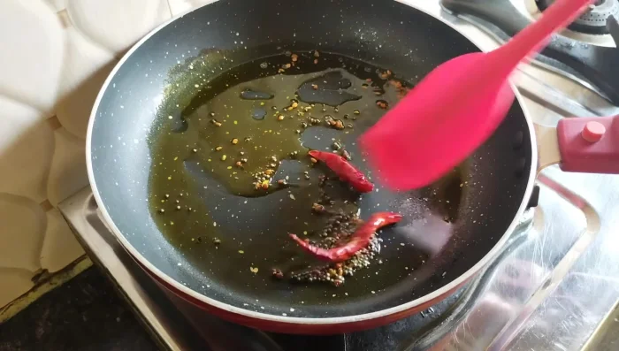 Add ginger-garlic-chili paste and fry for 2-3 minutes until the raw smell disappears.