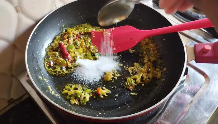 Add salt, turmeric powder, Kashmiri red chili powder, cumin seeds, and black pepper. Fry for 4-5 minutes.